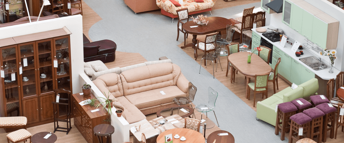A top down image of a selection of furniture in a store like sofas, barstools, tables and shelving all in different colours and styles.